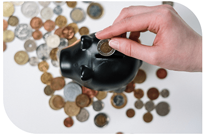 Coins and gold pieces being arranged on a table.